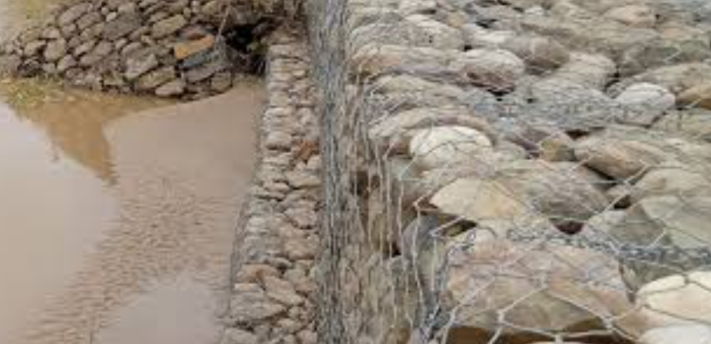 Makeshift embankment to prevent flooding in settlements