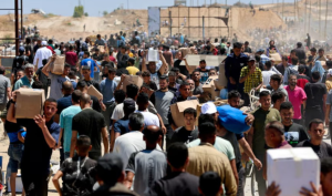 Aid Trucks Enter Gaza from Egypt Amid Ongoing Airdrops by Israel