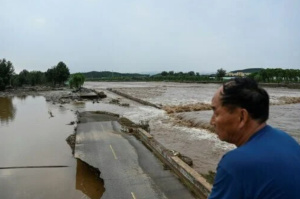Thirty dead as northern China hit by heavy rain, landslides